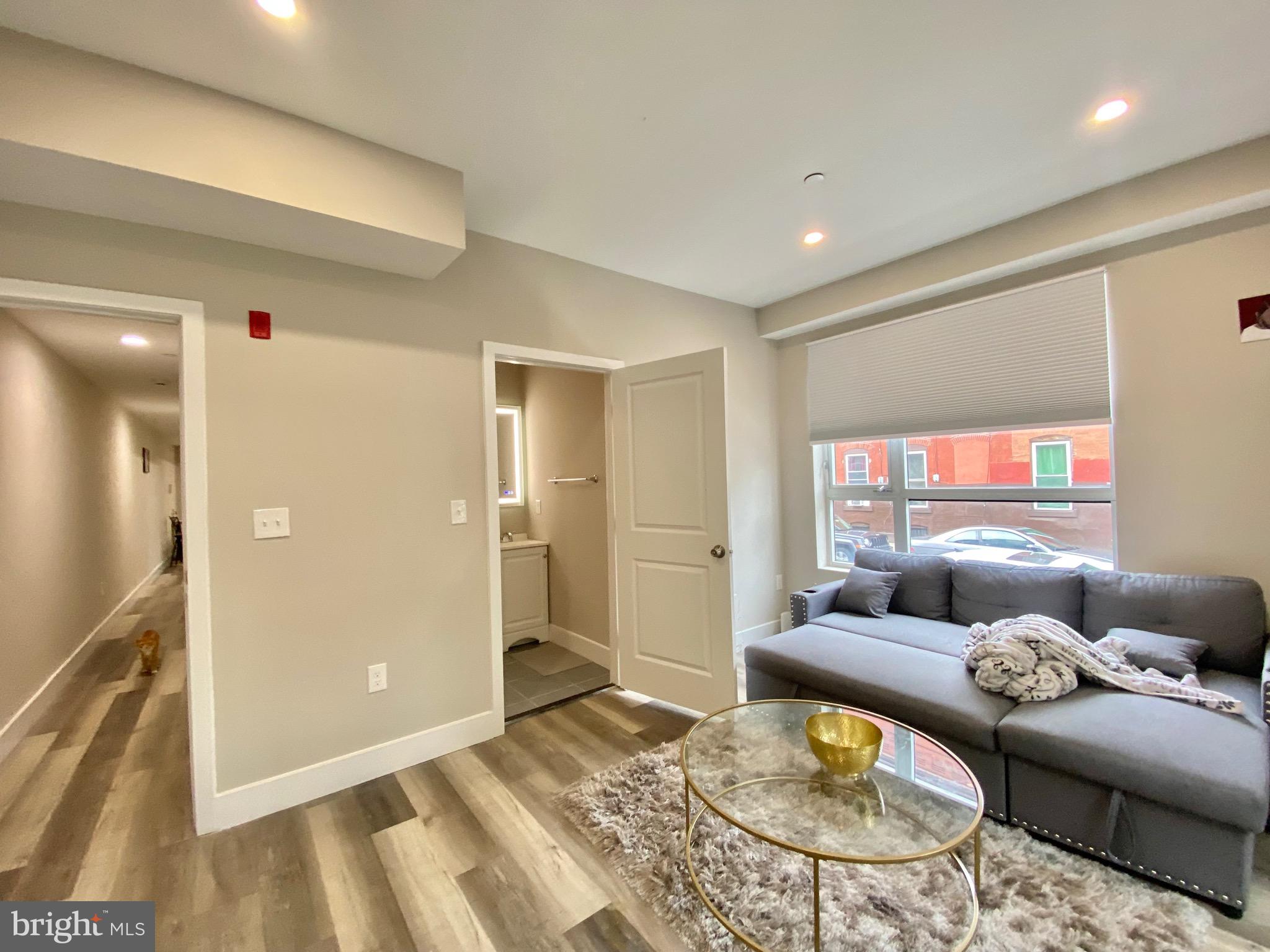 a living room with furniture and a table