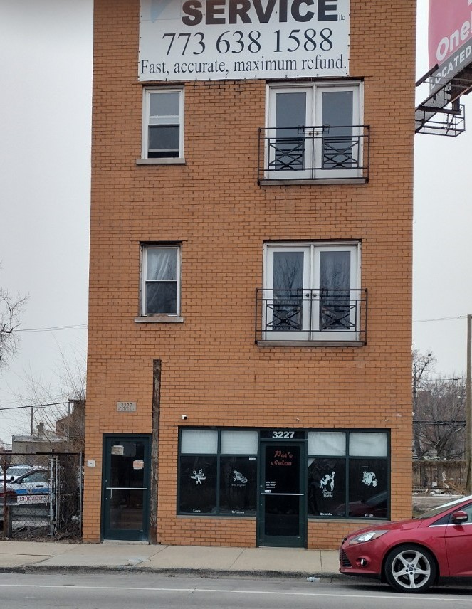 a front view of a house with parking space