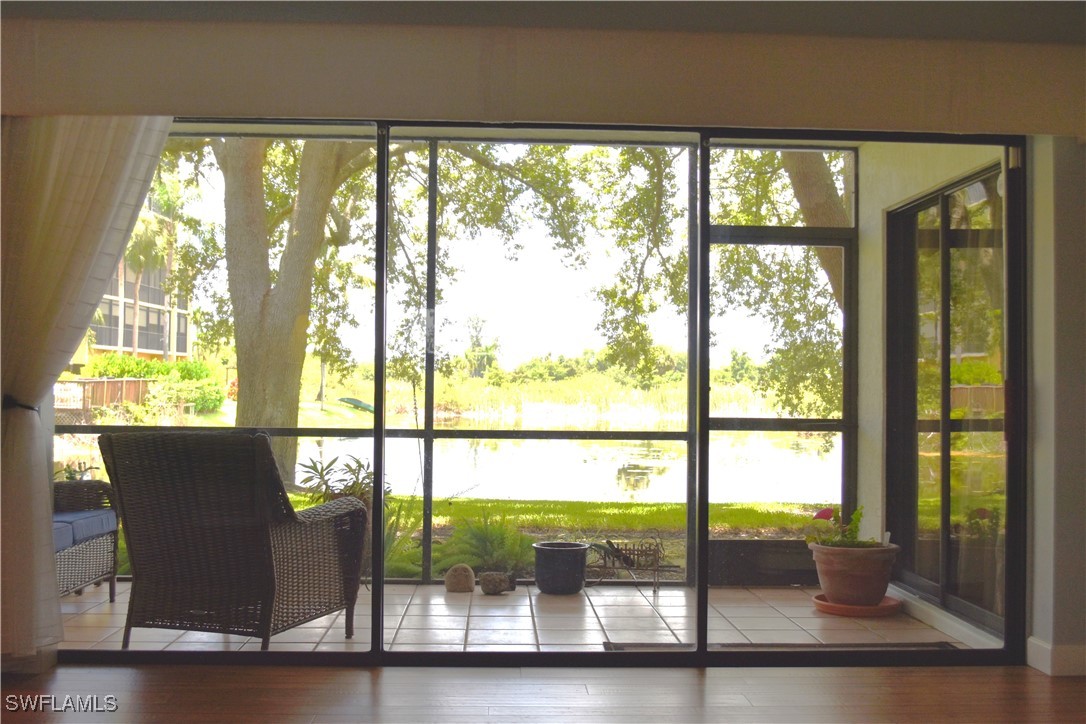 a view of a room with balcony and furniture