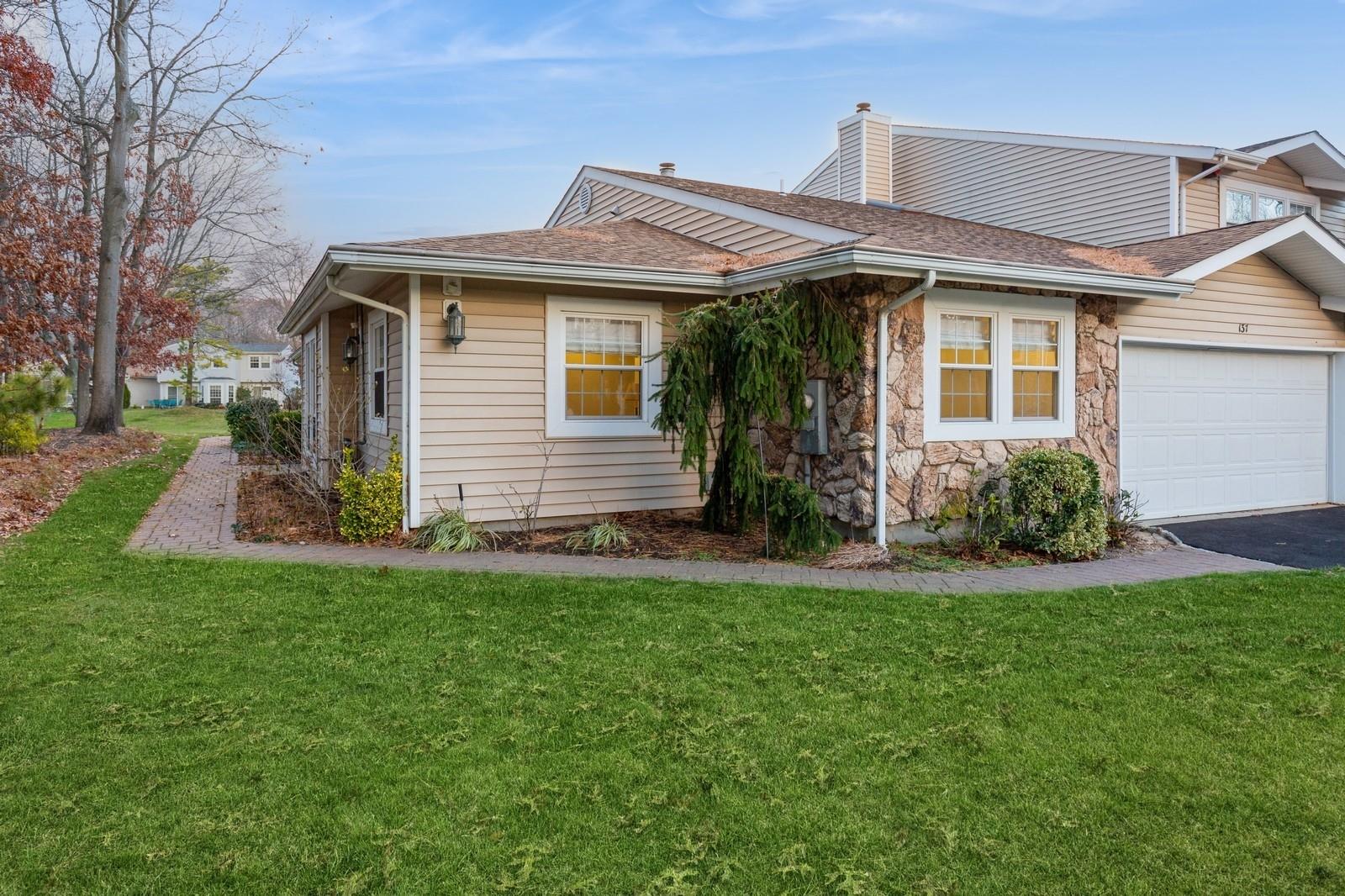 a front view of a house with a yard