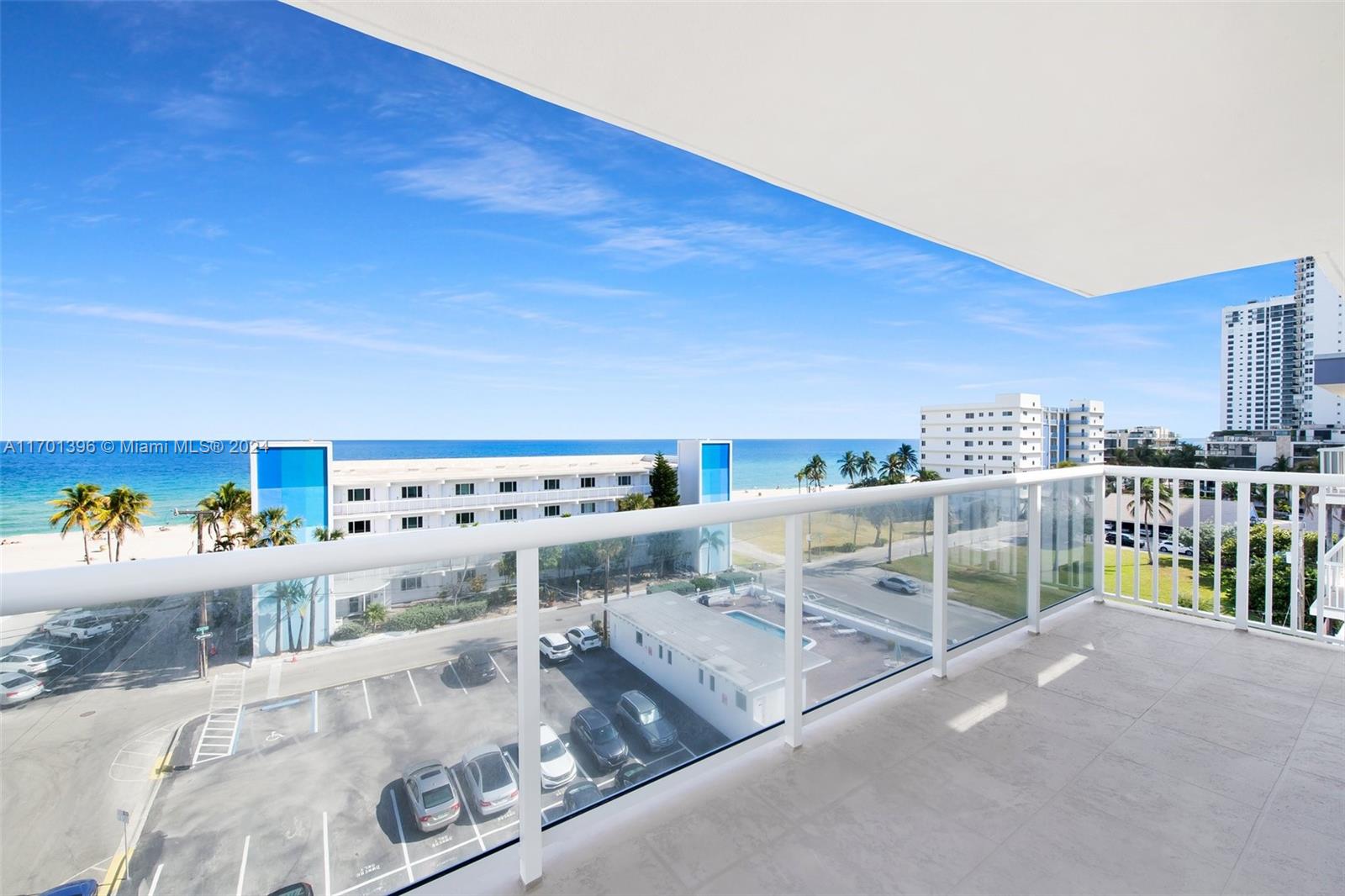 a view of a living room and a balcony