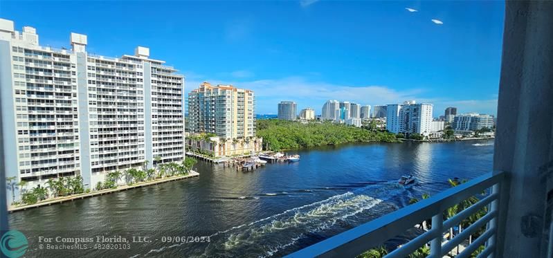 a view of a lake with tall buildings