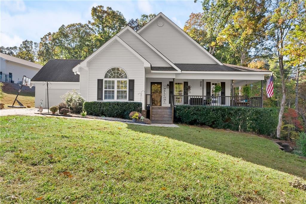 a front view of a house with a yard and garage