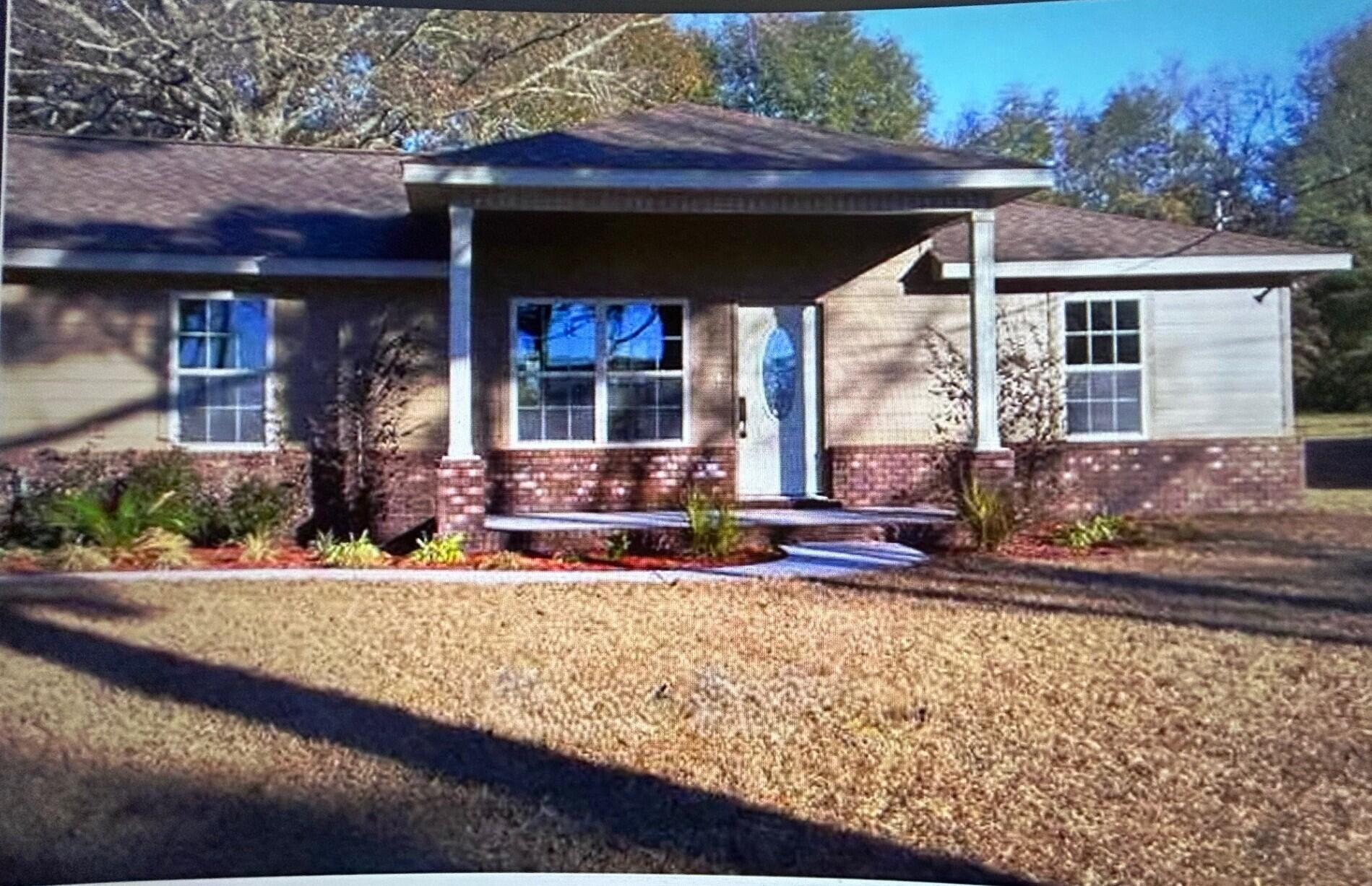 a view of house with outdoor space