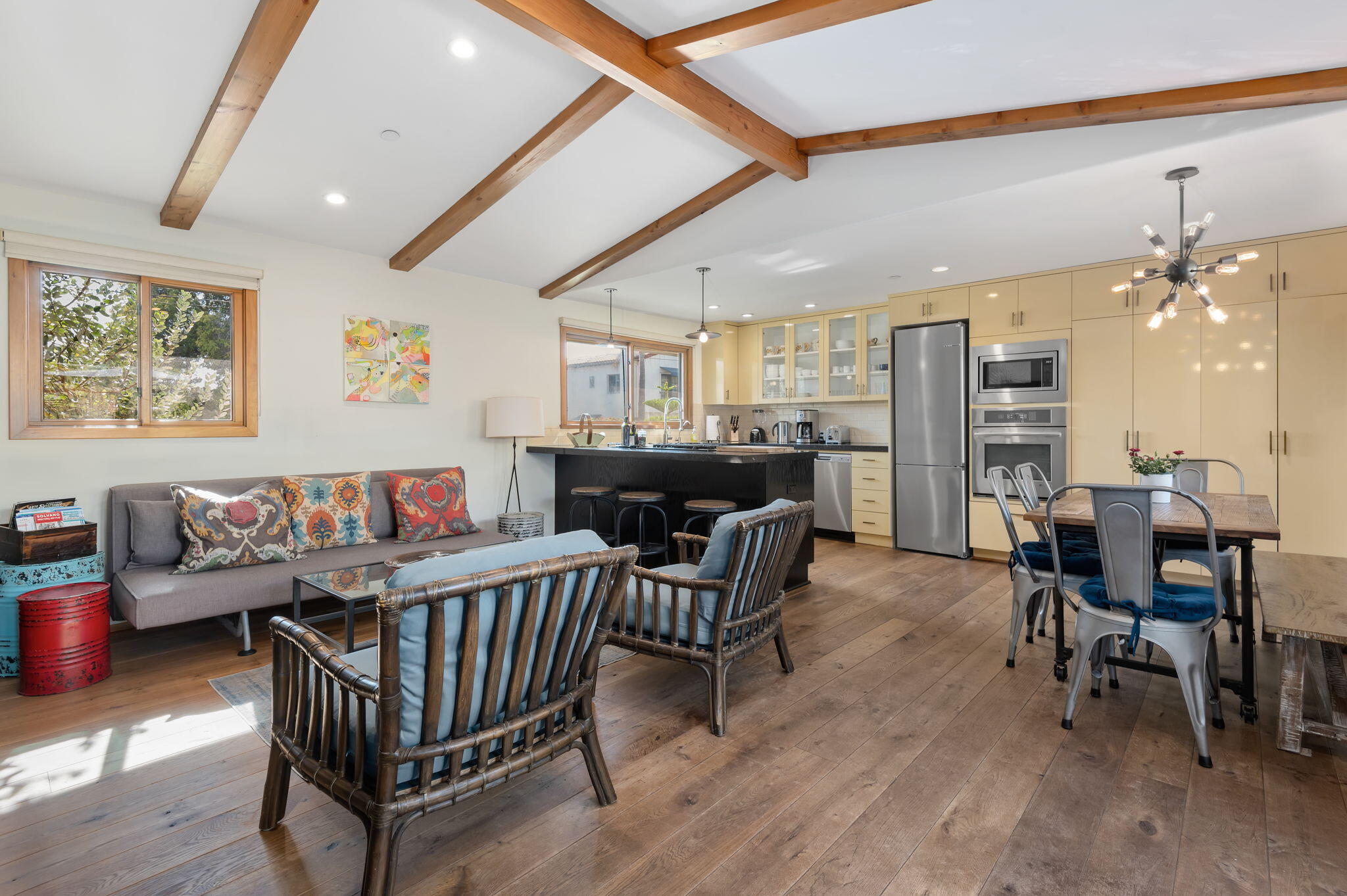 a dining room with furniture and wooden floor