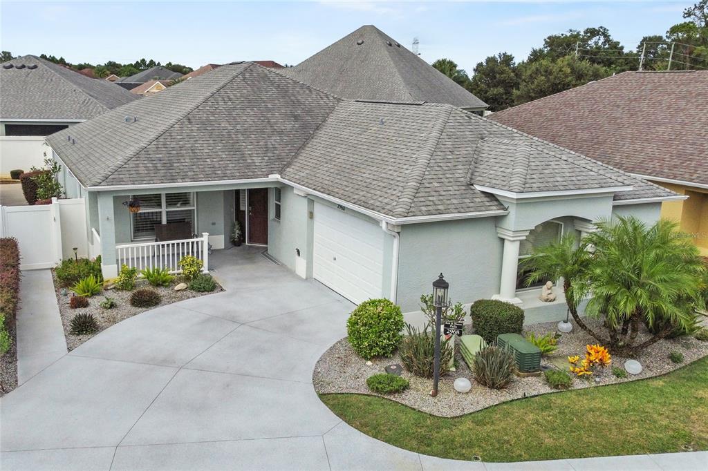 a aerial view of a house with table and chairs