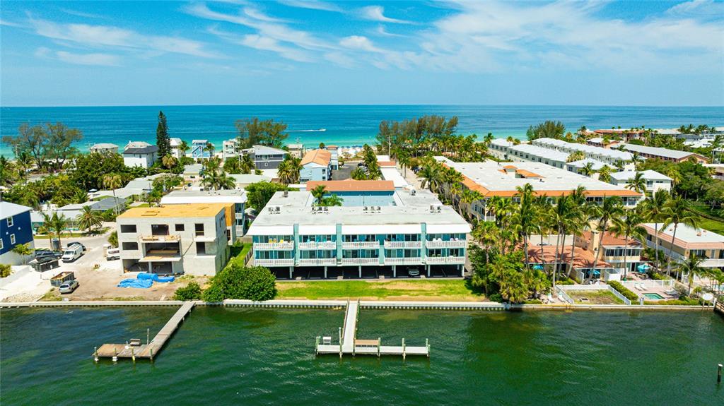 a view of an ocean with building in the background