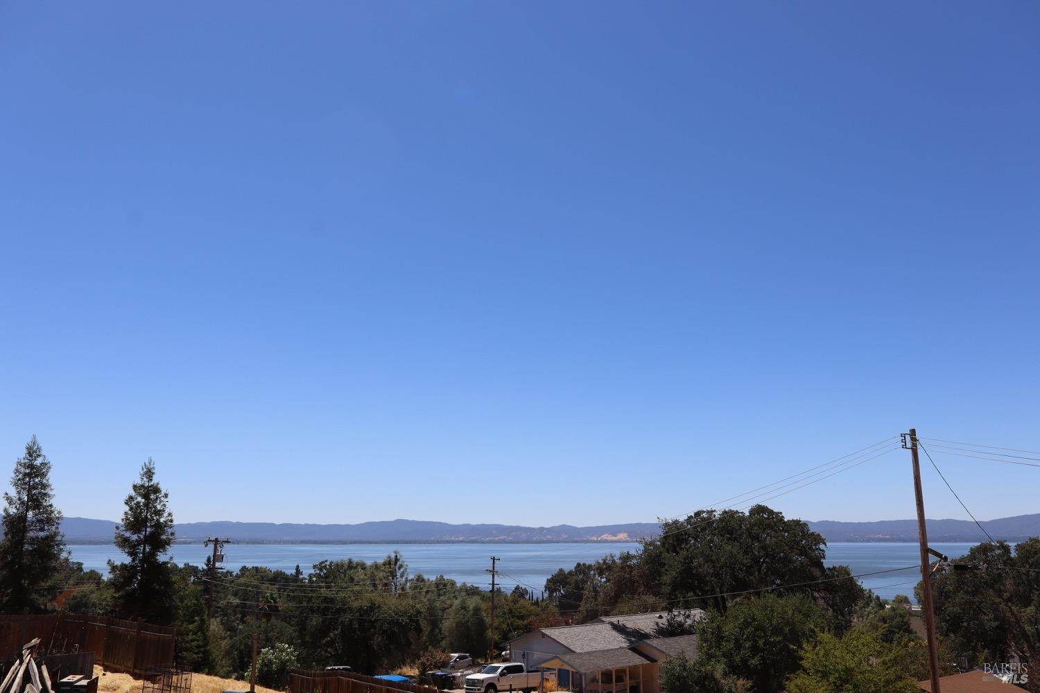 a view of a city with lots of palm trees