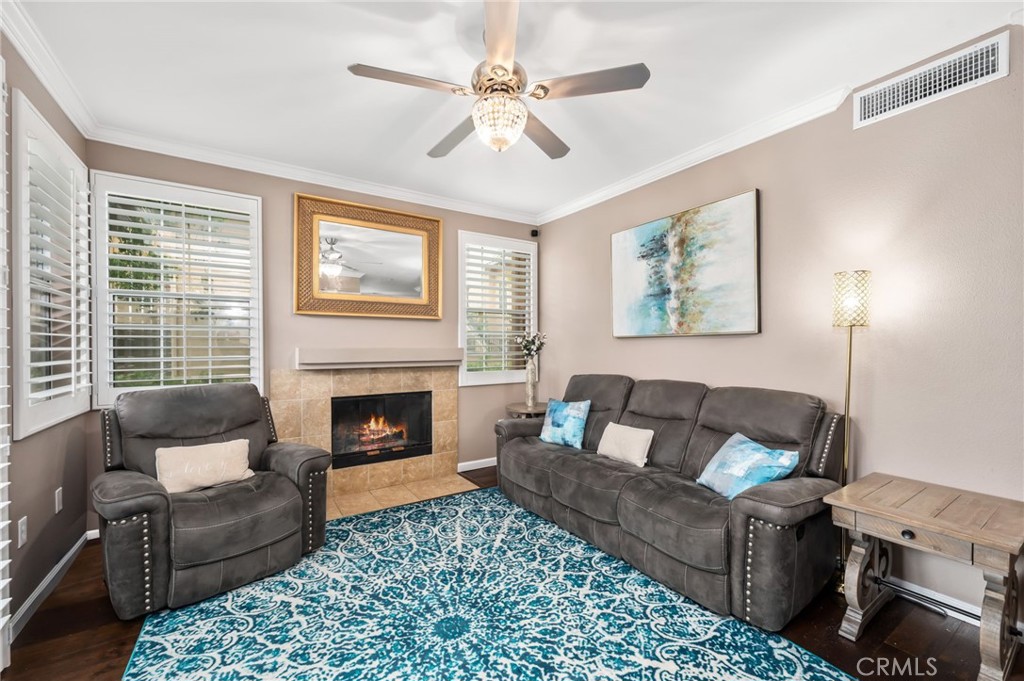 a living room with furniture and a fireplace