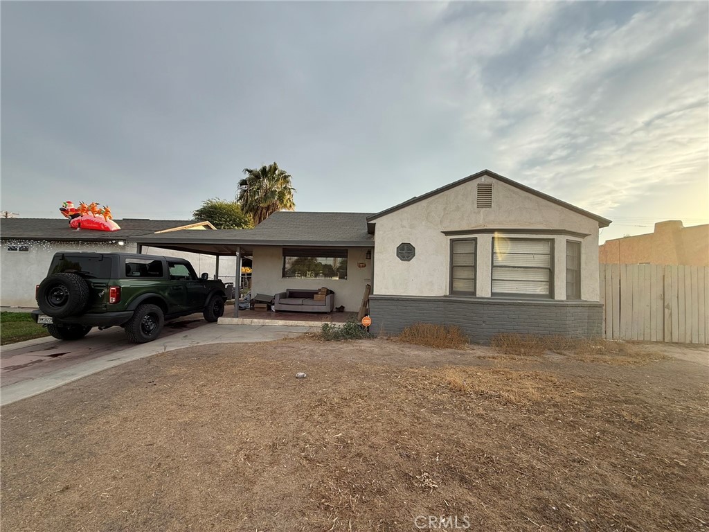 a view of garage and a car parked in it