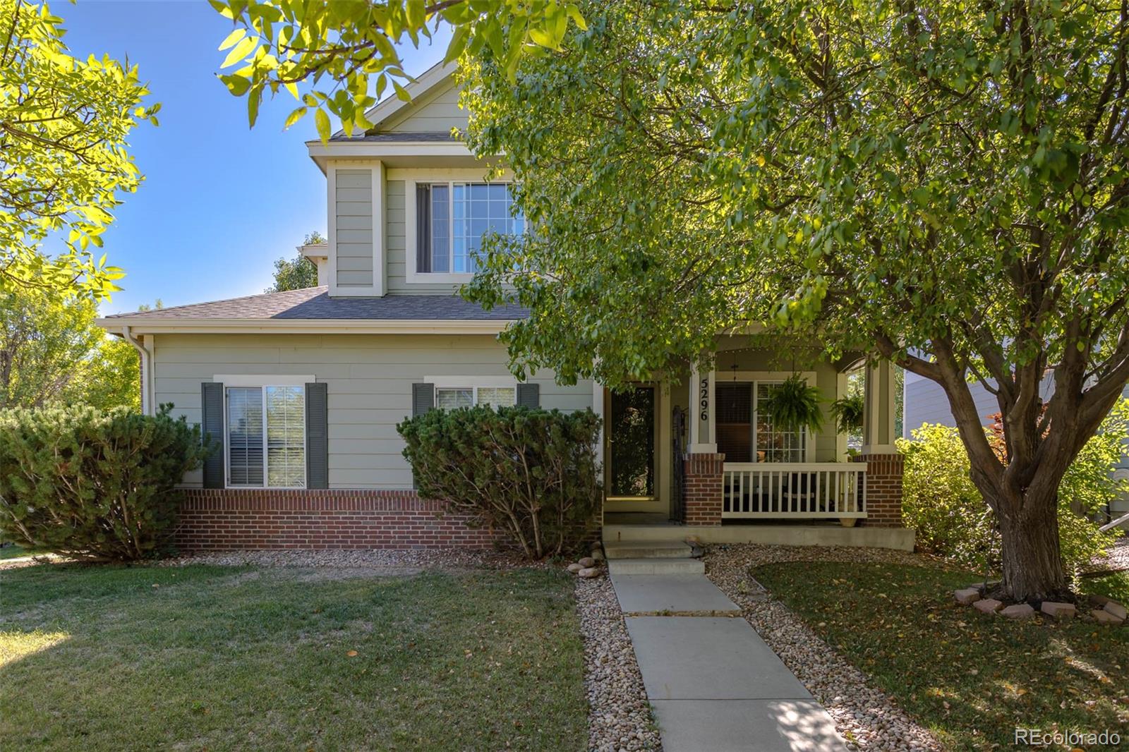 front view of a house with a garden