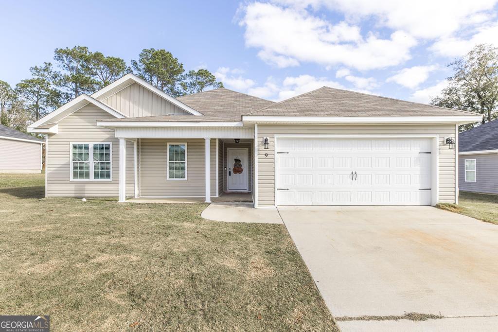 front view of a house with a yard