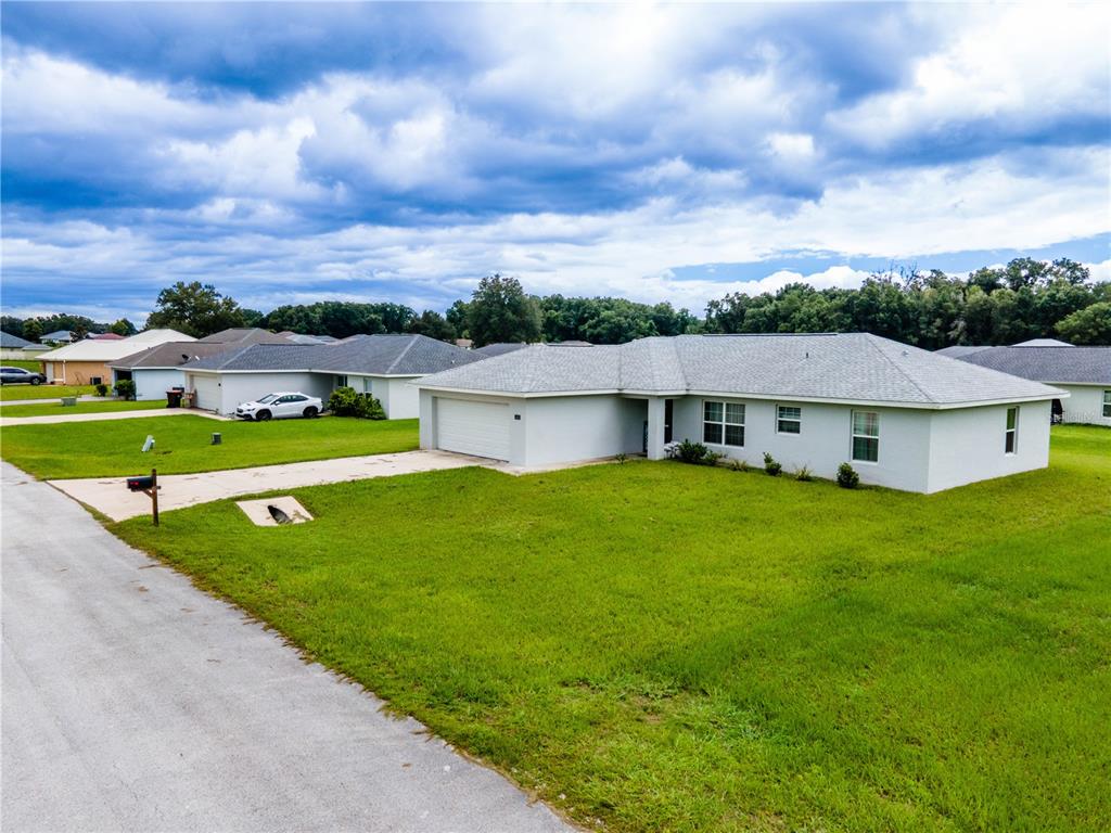 a view of a house with a big yard