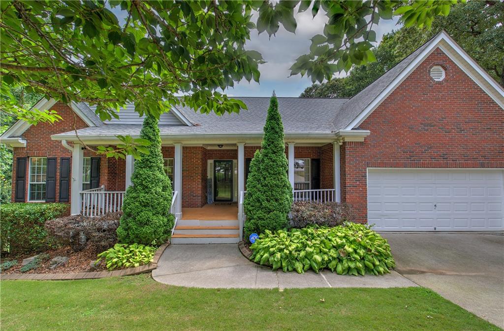 front view of a house with a yard