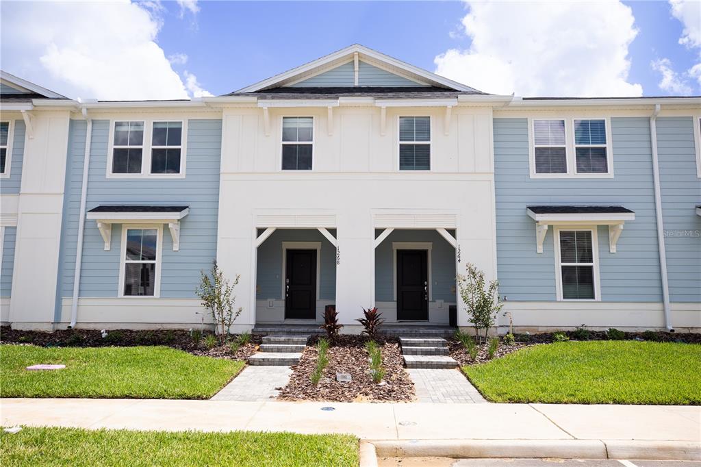 a front view of a house with yard