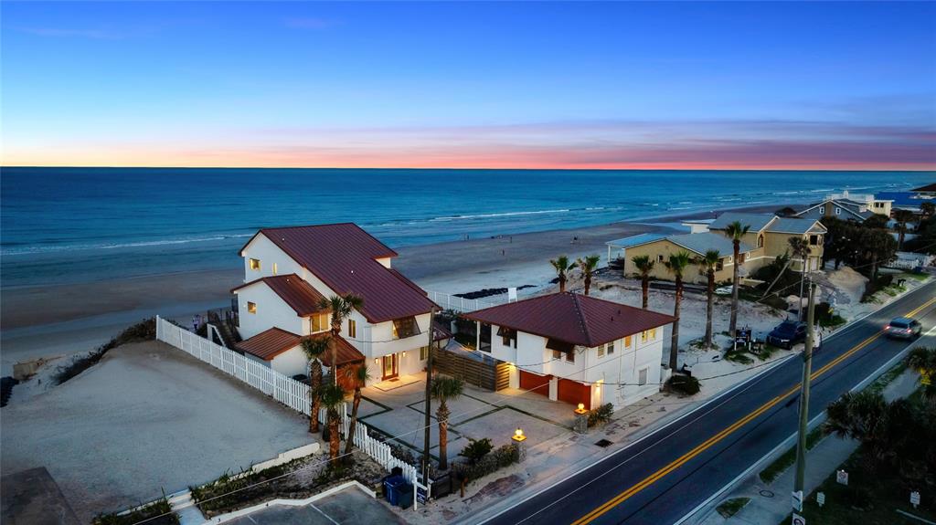 an aerial view of a balcony with an ocean view