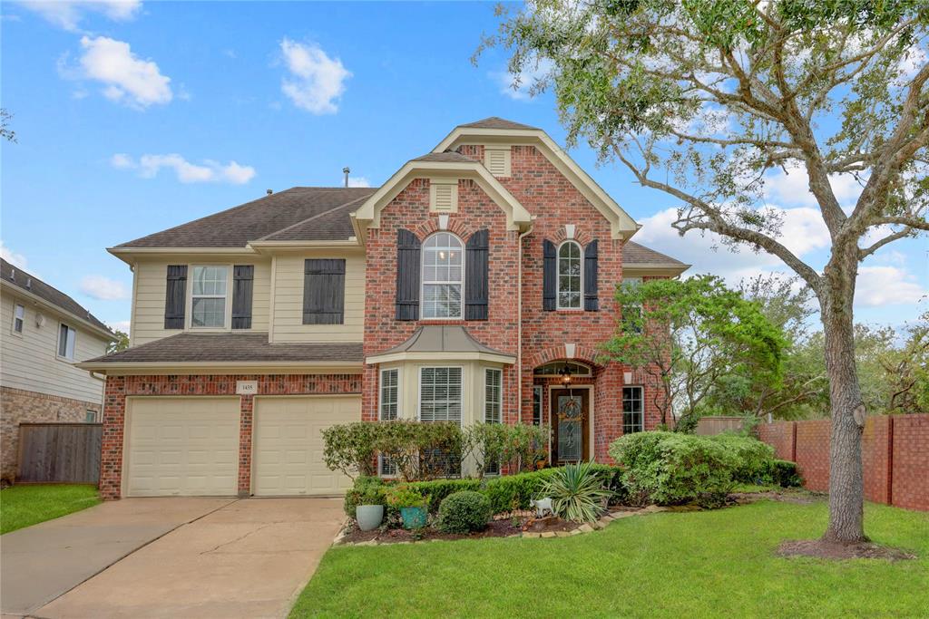 A STUNNING TWO-STORY BRICK HOME NESTLED AT THE END OF A QUIET CUL-DE-SAC, FEATURING A METICULOUSLY LANDSCAPED FRONT YARD THAT EXUDES CHARM AND OFFERS EXCEPTIONAL CURB APPEAL.