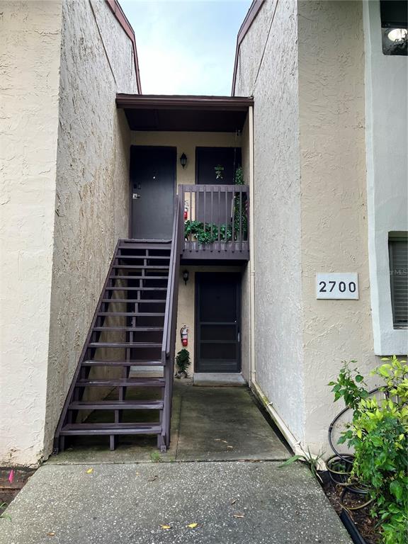 a view of entryway with wooden door