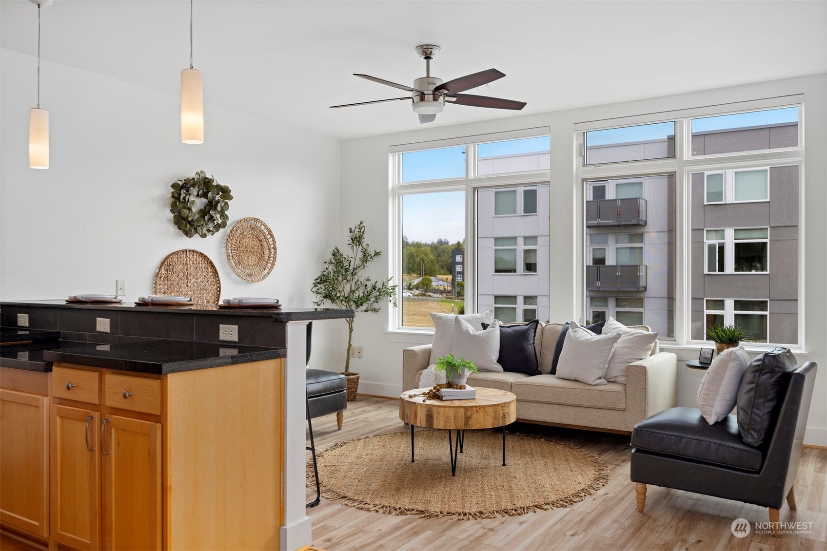 a living room with furniture and wooden floor