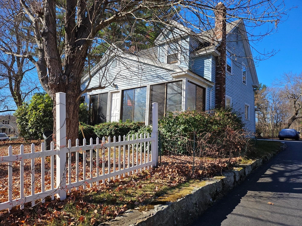 a view of a house with a small yard and plants