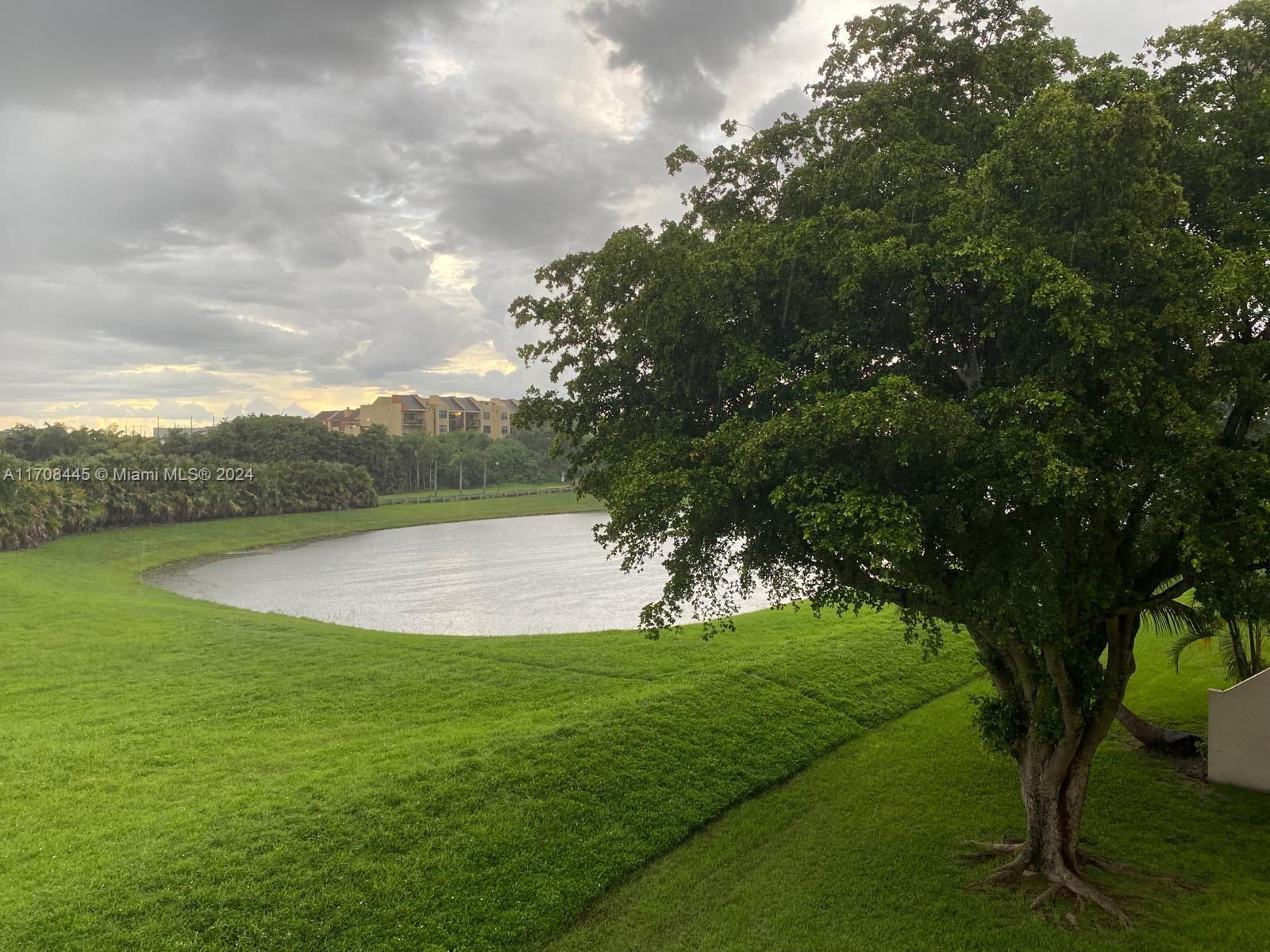 a view of a golf course with a lake