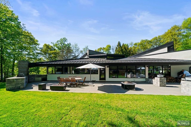 a swimming pool view with a seating space