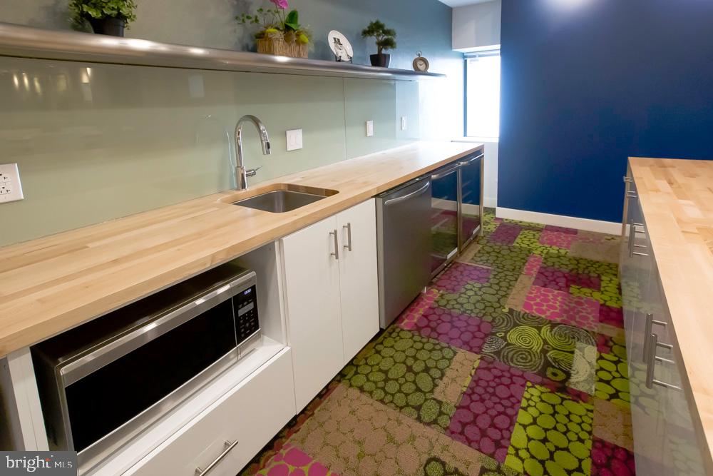 a kitchen with a stove and a microwave