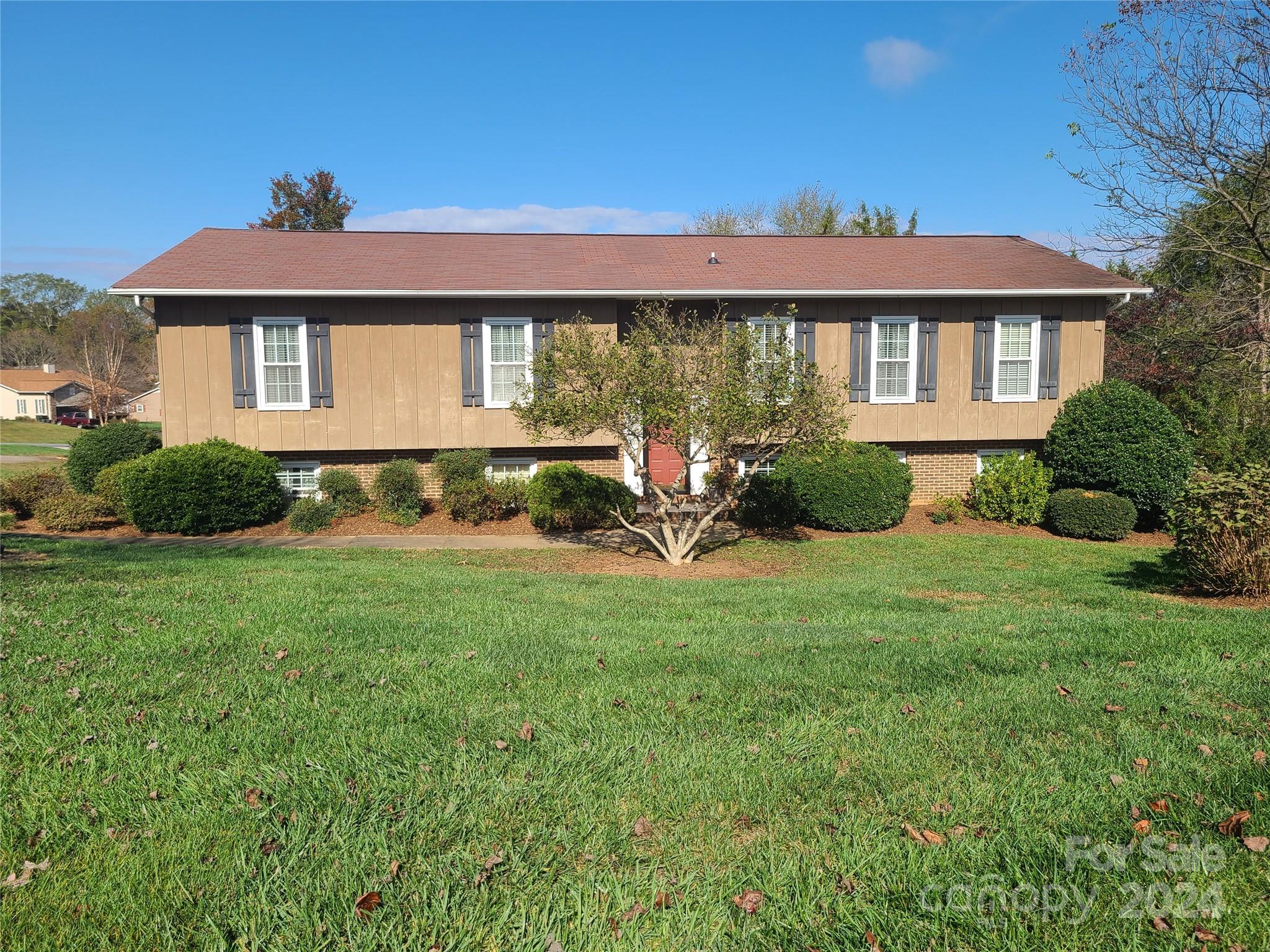 a front view of a house with a yard