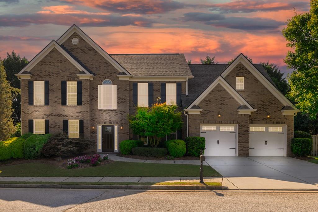 a front view of a house with a yard