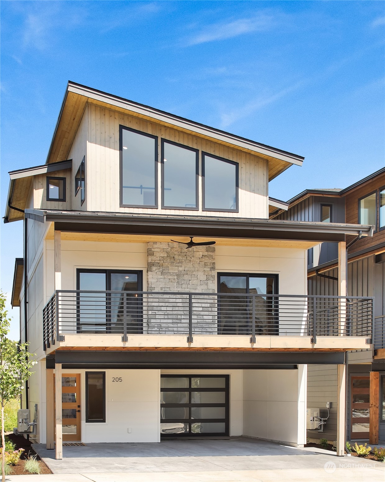 a front view of a house with large windows