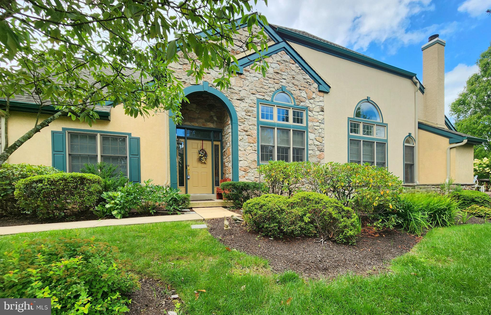 front view of a house with a yard