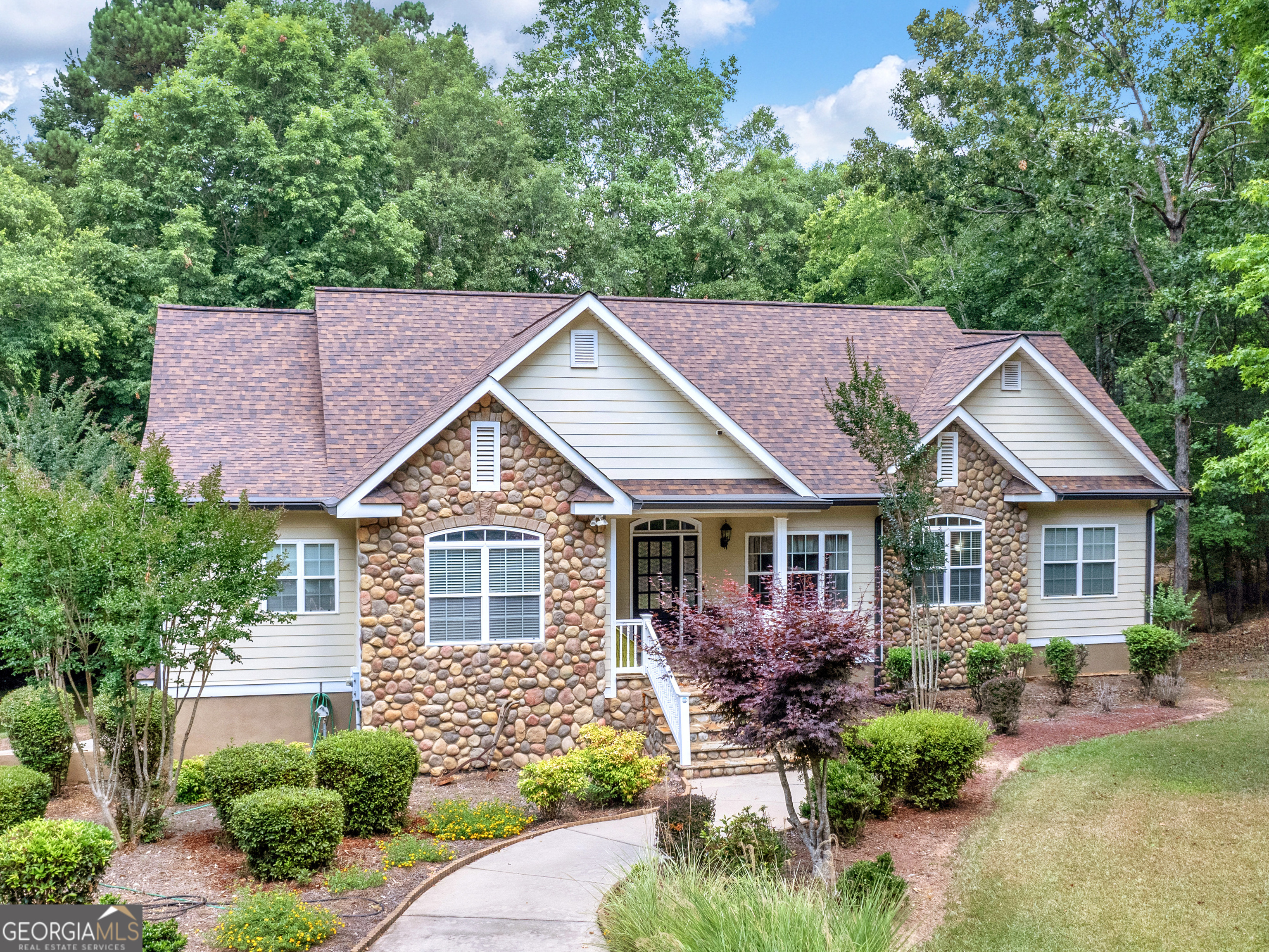 front view of a house with a yard