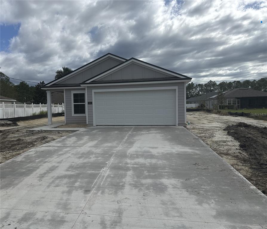 a front view of the house with a yard