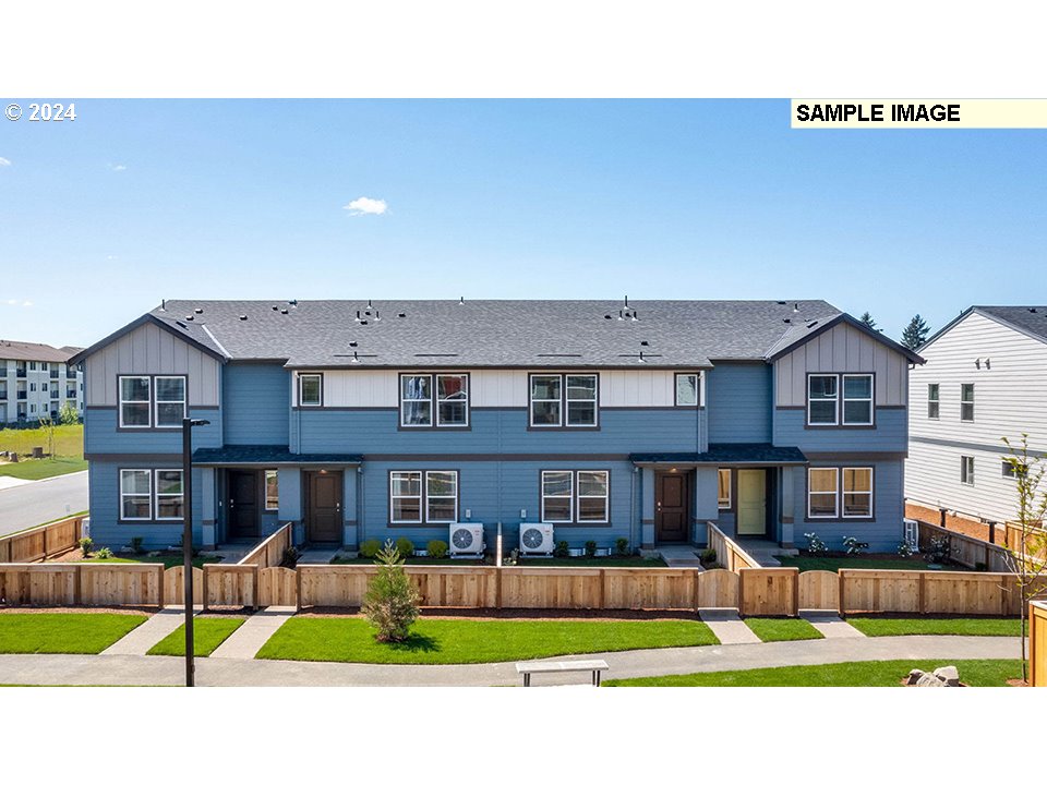 a view of houses with a yard