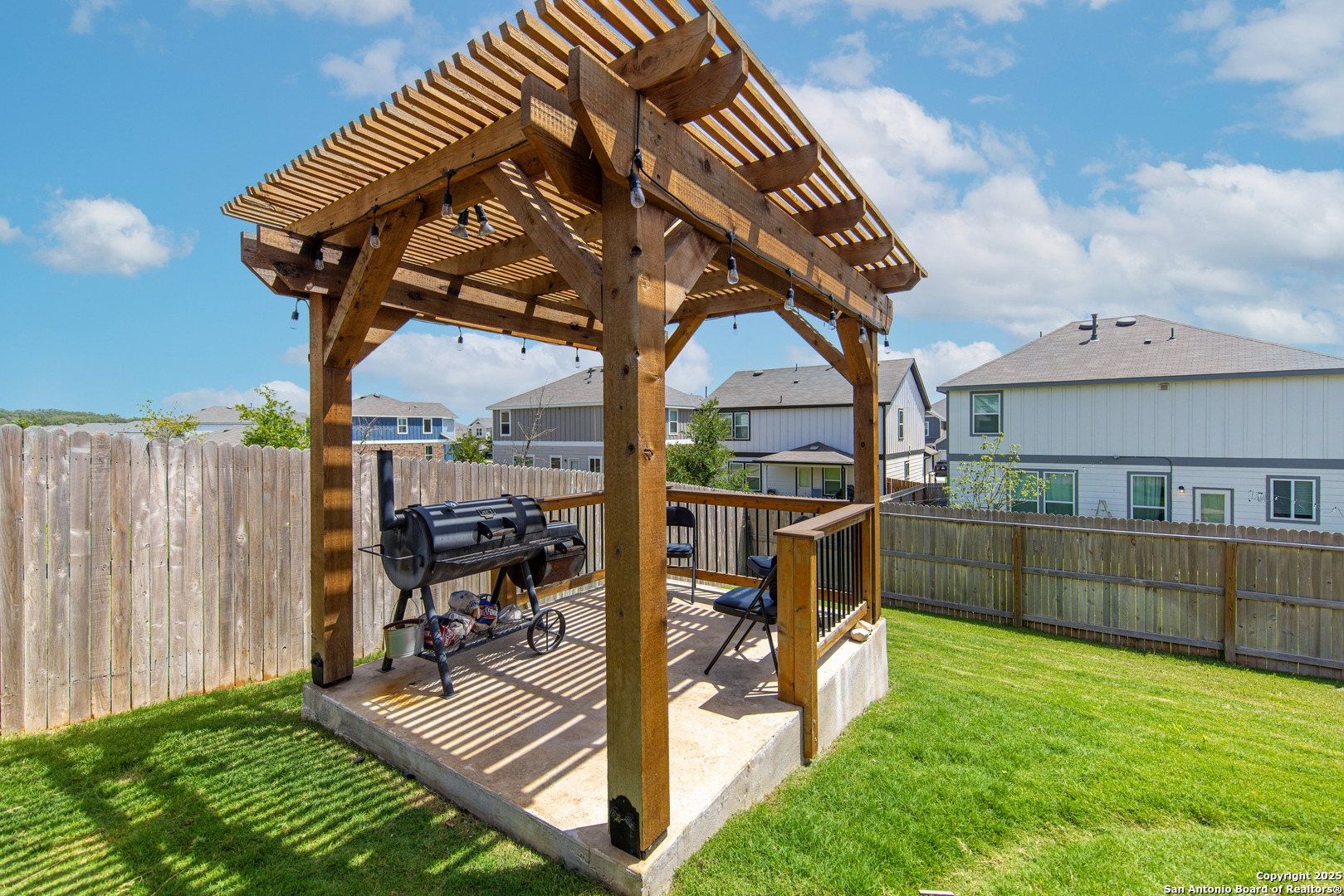 a view of a backyard with sitting area