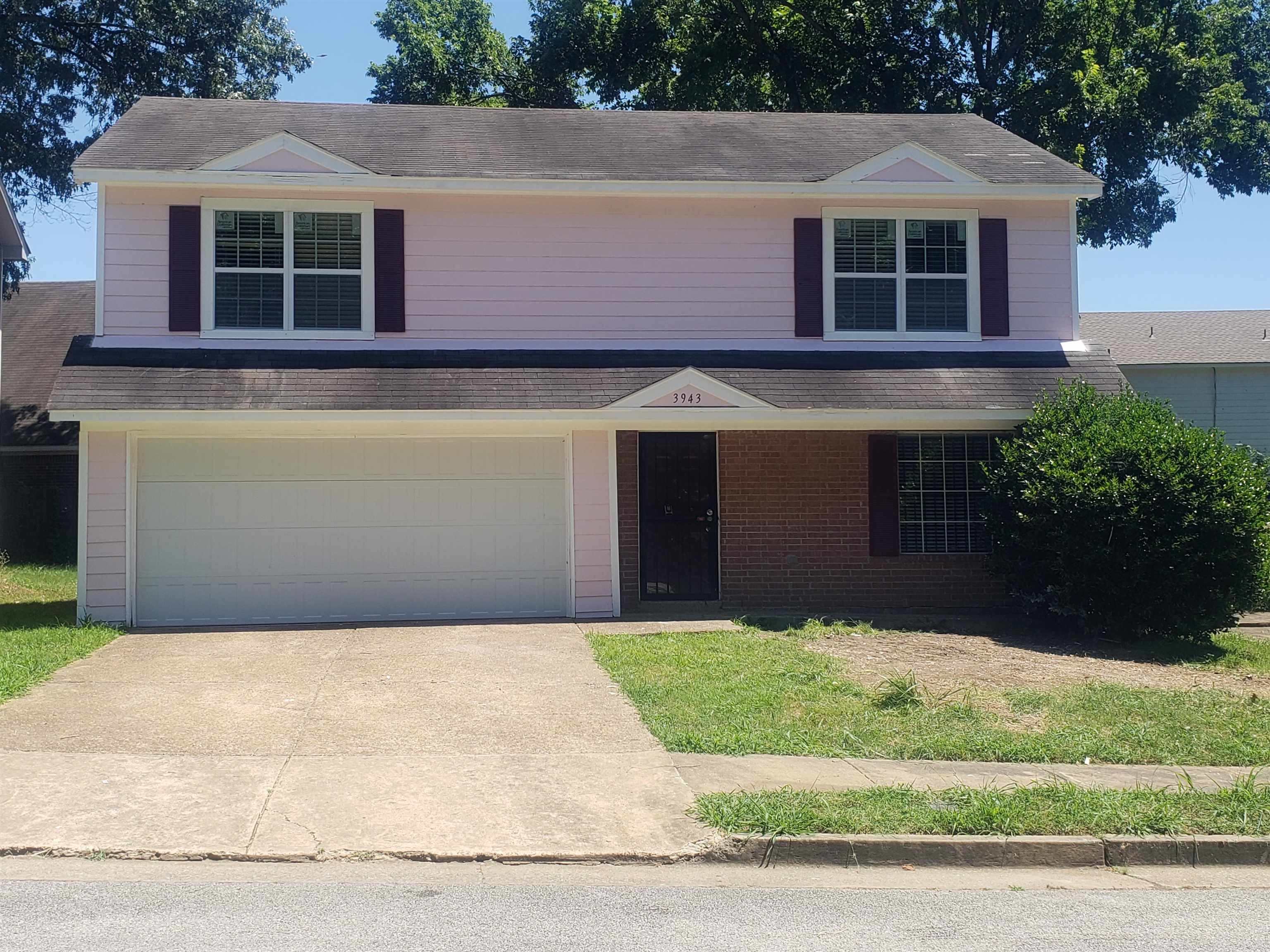 Front of property with a garage