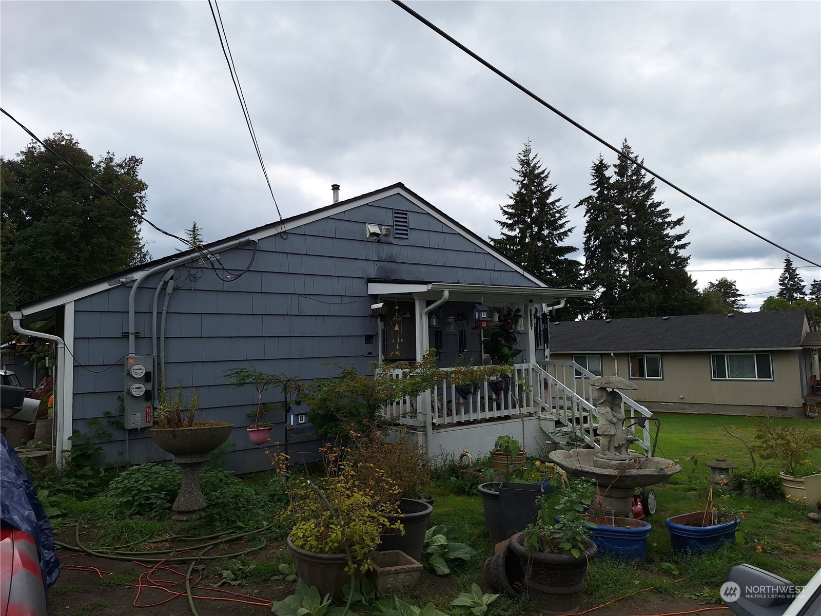 a front view of a house with garden