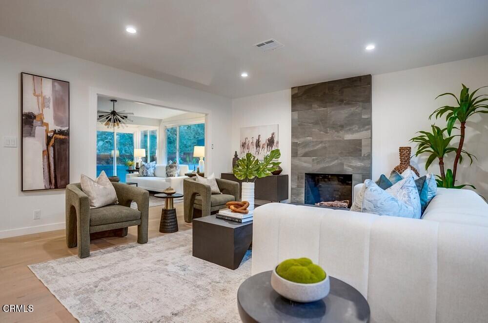 a living room with furniture and a fireplace