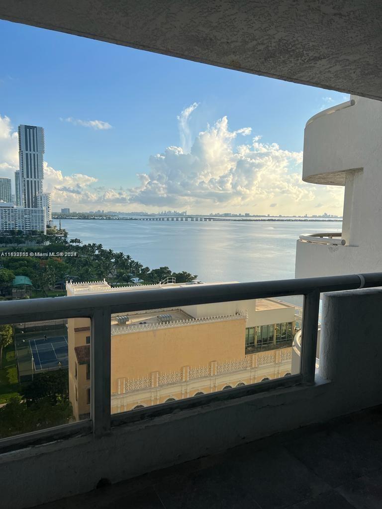 a view of a lake from a balcony