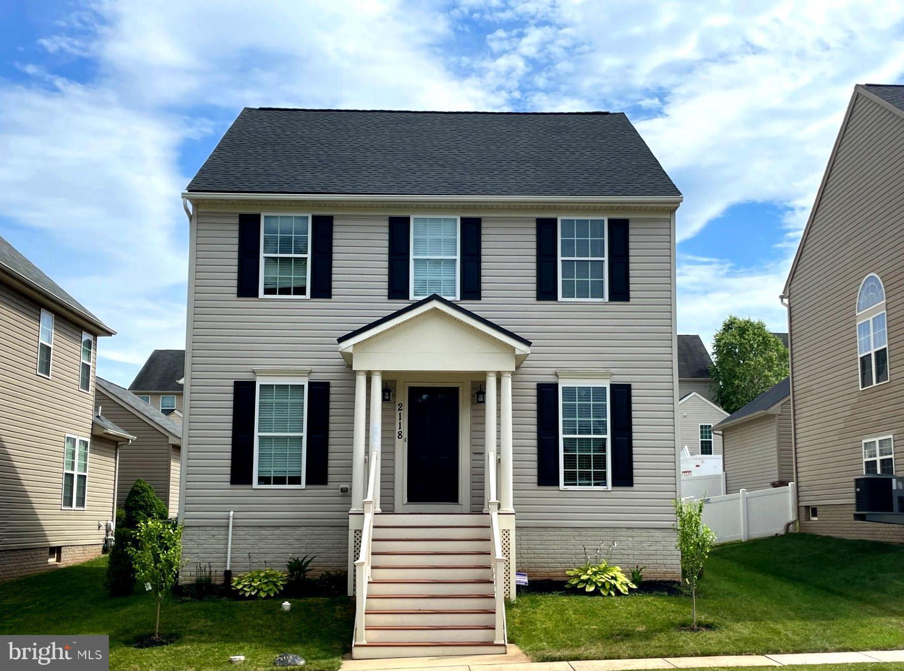 front view of a house and a yard