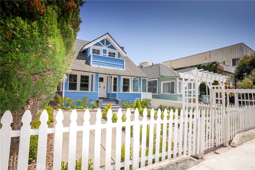 a front view of a house with a small yard