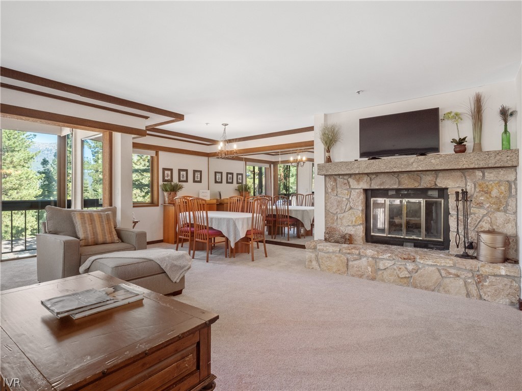 a living room with furniture fireplace and flat screen tv