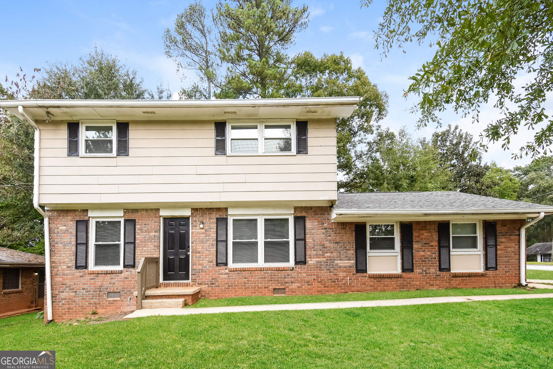 front view of a house with a yard