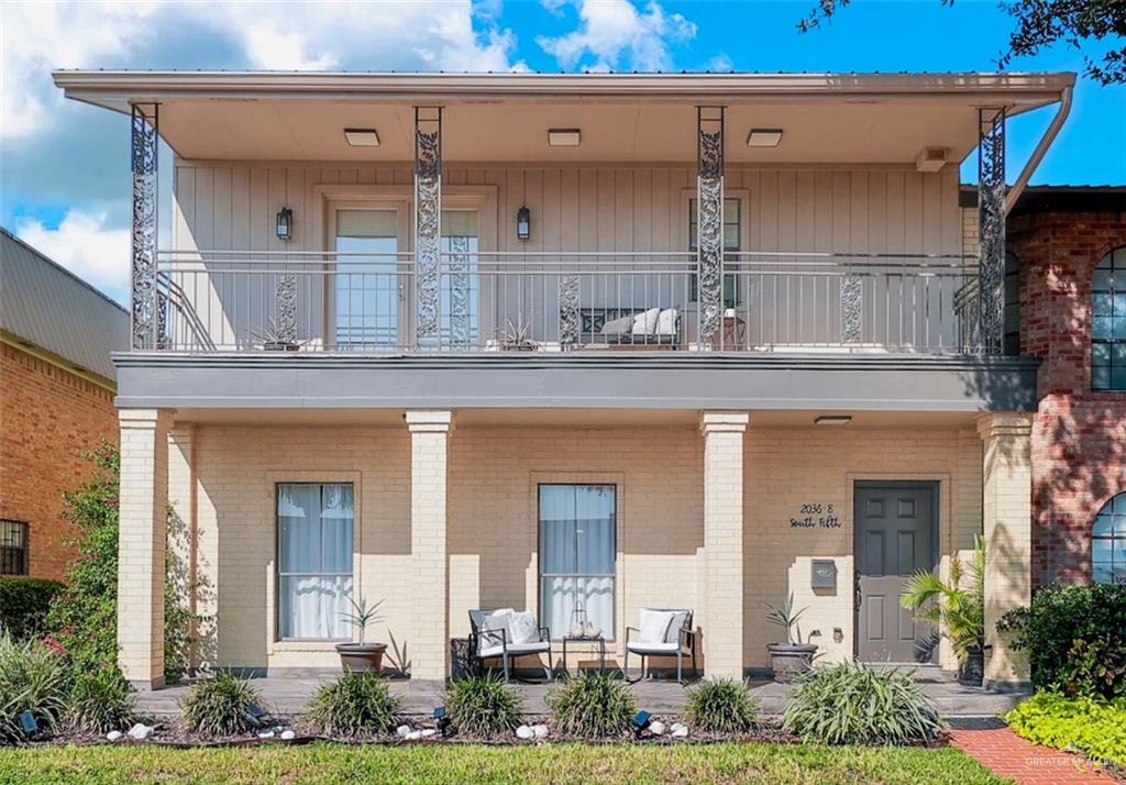 View of front of house with a balcony