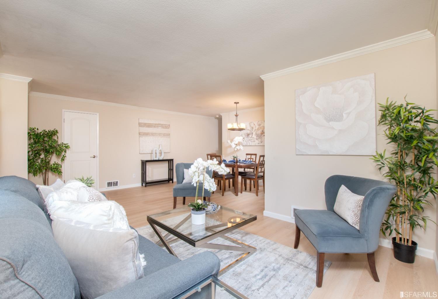 a living room with furniture and a table