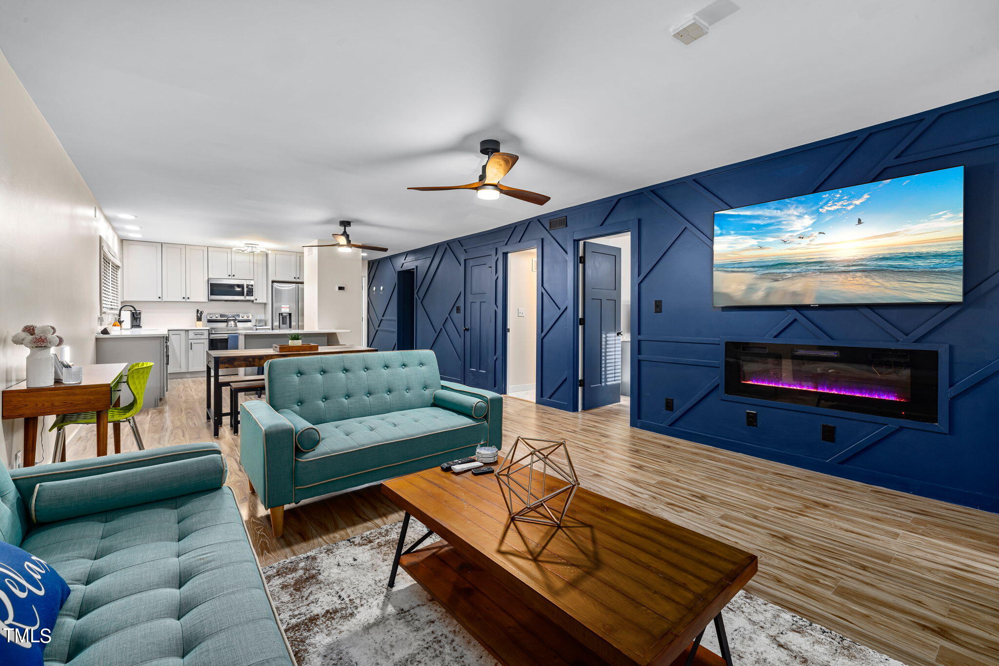 a living room with furniture and a flat screen tv