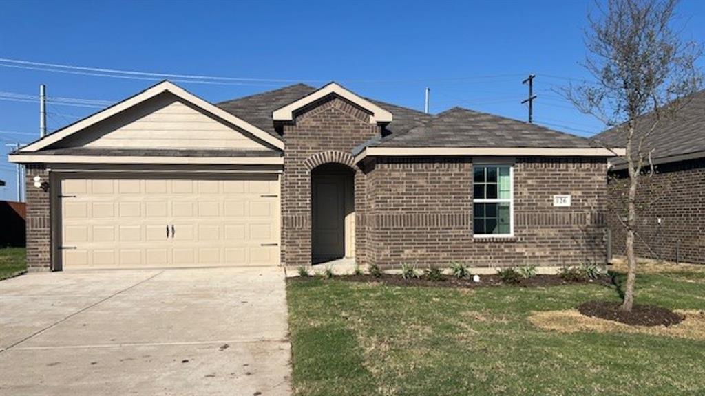 a front view of a house with garage