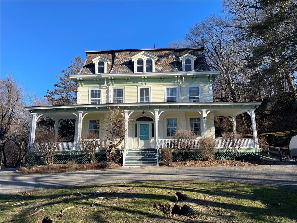 a front view of a house with yard