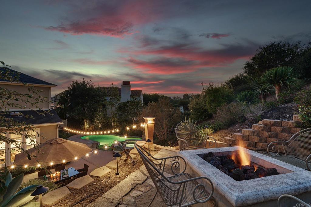 a view of swimming pool with outdoor seating