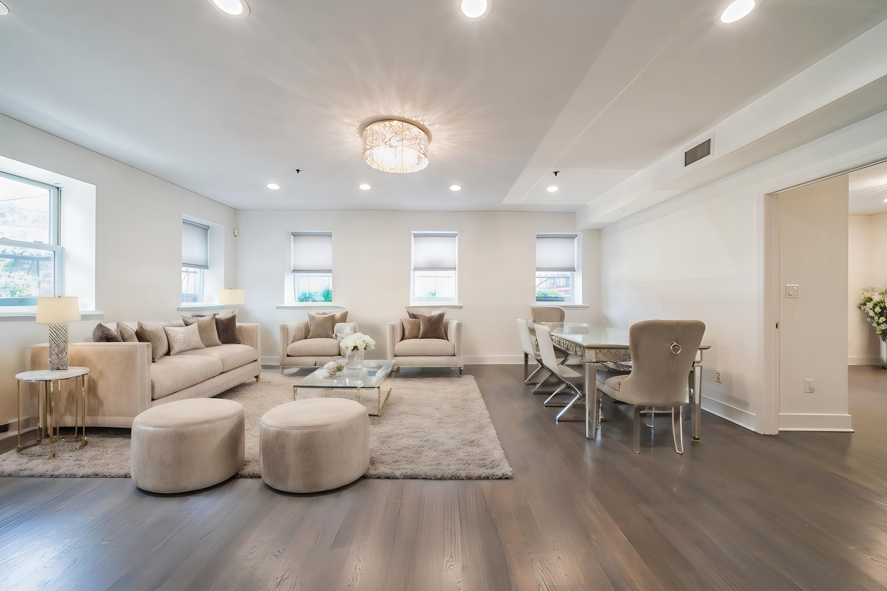 a living room with furniture wooden floor and a table